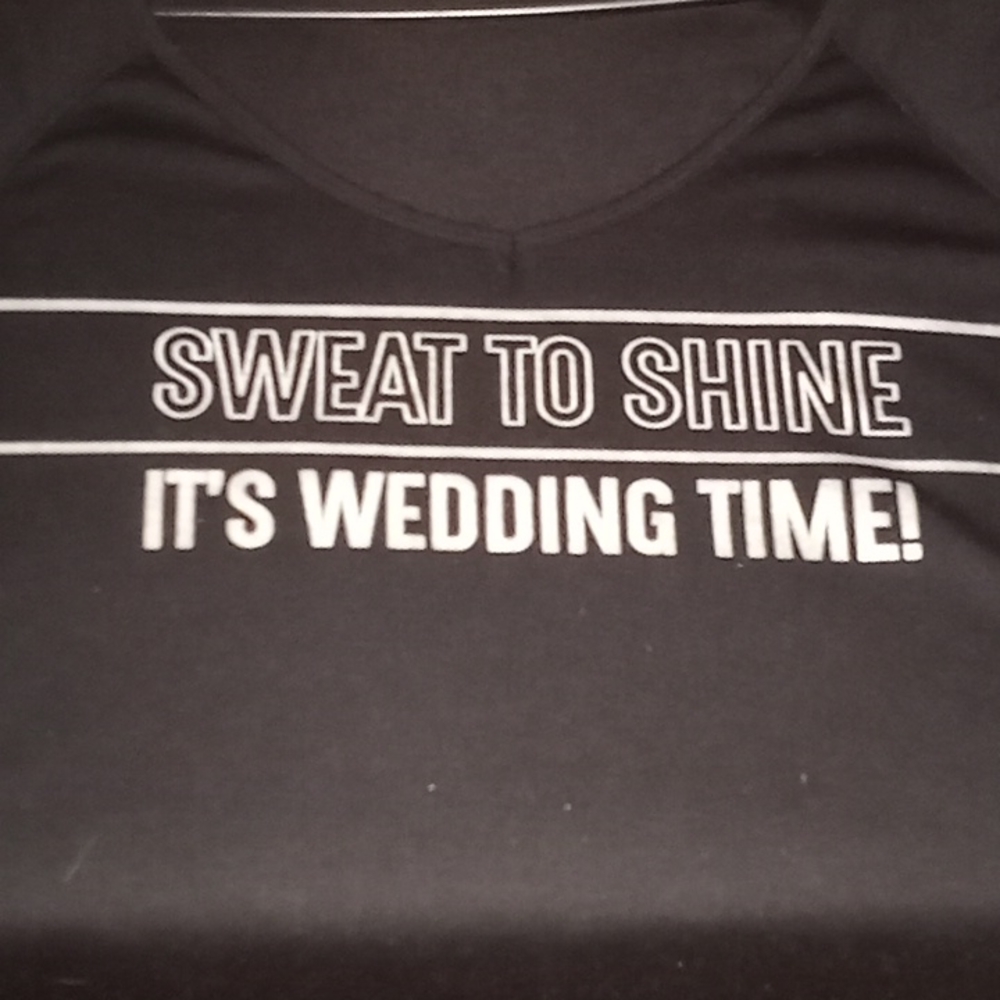 A Bridesmaid shirt. Black with Silver writing.